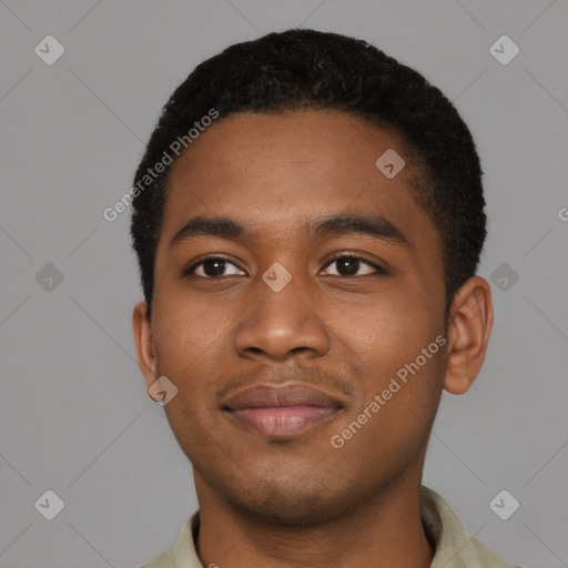 Joyful black young-adult male with short  black hair and brown eyes