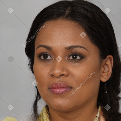 Joyful black young-adult female with long  brown hair and brown eyes