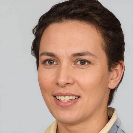 Joyful white adult female with short  brown hair and brown eyes