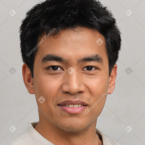 Joyful asian young-adult male with short  black hair and brown eyes