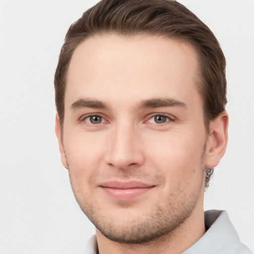 Joyful white young-adult male with short  brown hair and brown eyes