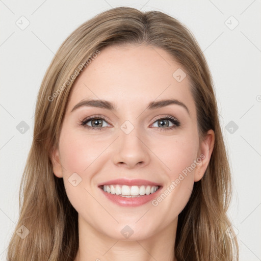 Joyful white young-adult female with long  brown hair and grey eyes