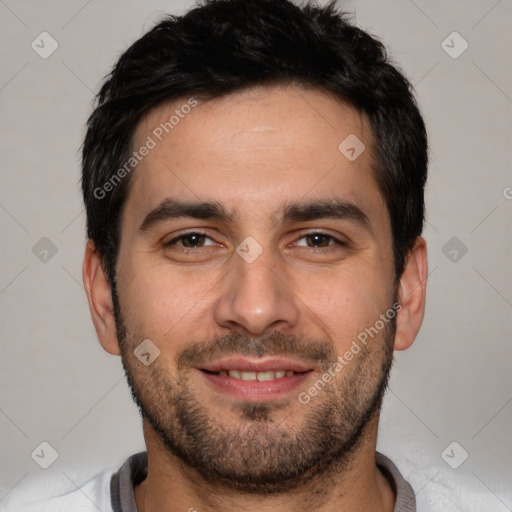 Joyful white young-adult male with short  black hair and brown eyes