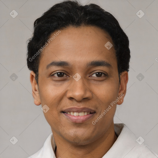 Joyful latino young-adult male with short  black hair and brown eyes