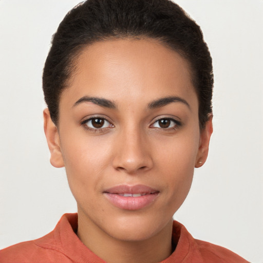 Joyful latino young-adult female with short  brown hair and brown eyes