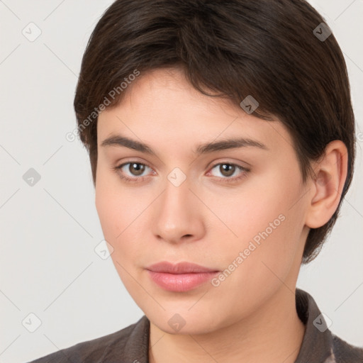 Neutral white young-adult female with short  brown hair and brown eyes