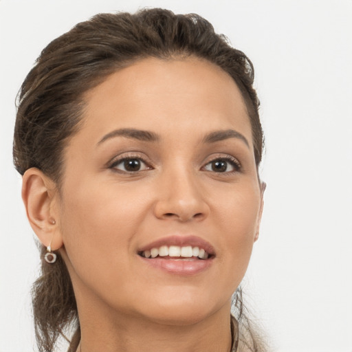 Joyful white young-adult female with long  brown hair and brown eyes