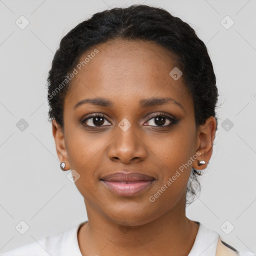 Joyful black young-adult female with short  black hair and brown eyes