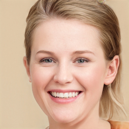 Joyful white young-adult female with medium  brown hair and blue eyes