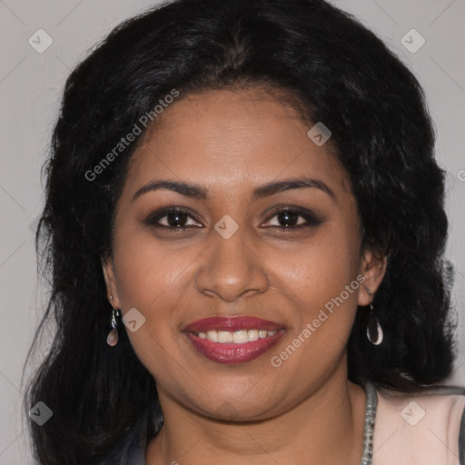 Joyful black young-adult female with long  brown hair and brown eyes