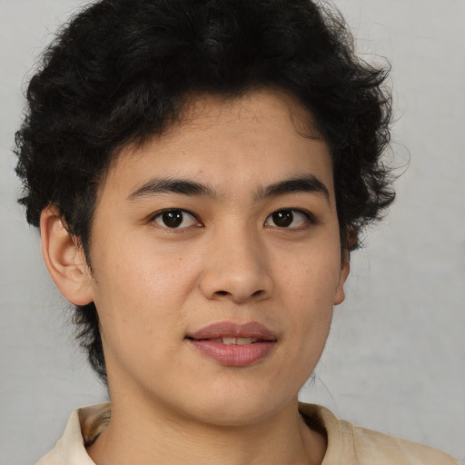 Joyful latino young-adult male with short  brown hair and brown eyes