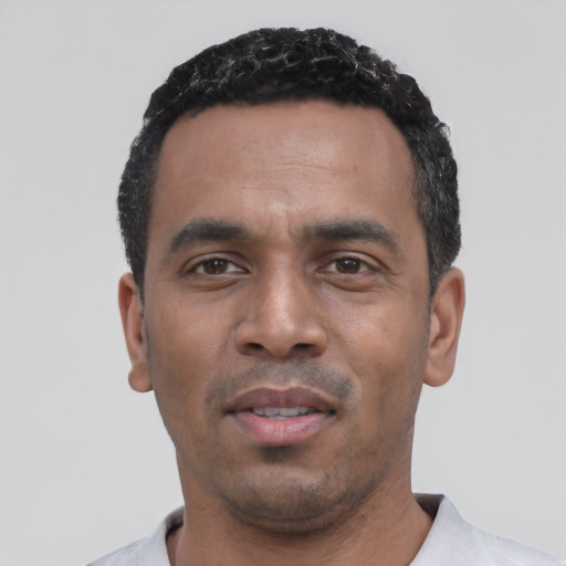 Neutral black young-adult male with short  black hair and brown eyes