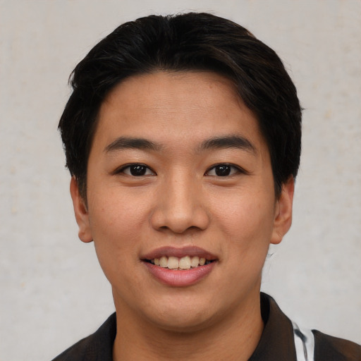 Joyful asian young-adult female with short  brown hair and brown eyes