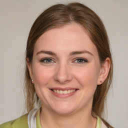 Joyful white young-adult female with medium  brown hair and grey eyes