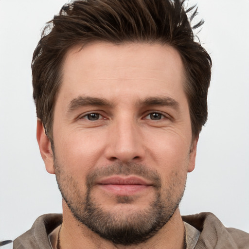 Joyful white young-adult male with short  brown hair and brown eyes