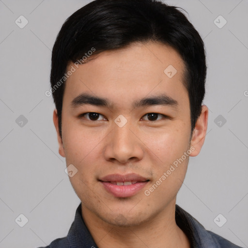 Joyful asian young-adult male with short  black hair and brown eyes