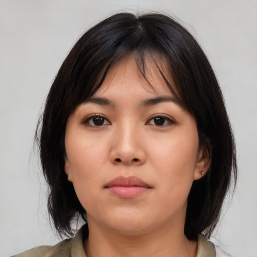 Neutral asian young-adult female with medium  brown hair and brown eyes