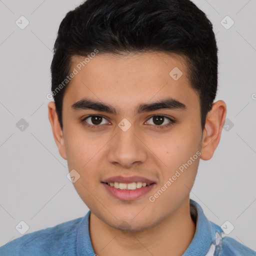 Joyful white young-adult male with short  black hair and brown eyes