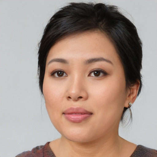 Neutral asian young-adult female with medium  black hair and brown eyes