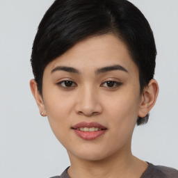 Joyful asian young-adult female with short  black hair and brown eyes