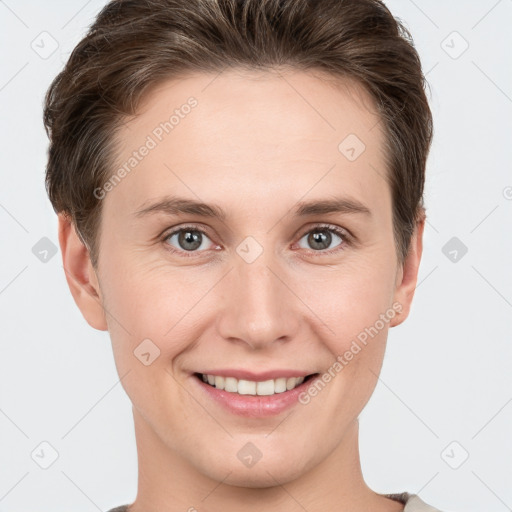 Joyful white young-adult female with short  brown hair and grey eyes