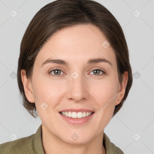 Joyful white young-adult female with medium  brown hair and grey eyes