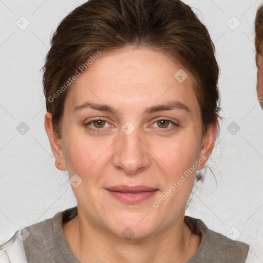 Joyful white adult female with medium  brown hair and grey eyes