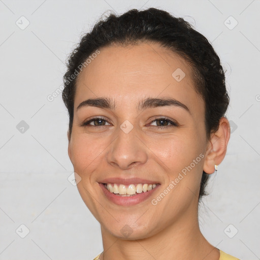 Joyful white young-adult female with short  brown hair and brown eyes