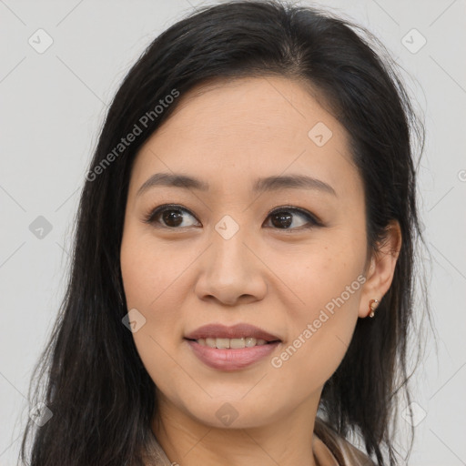 Joyful asian young-adult female with long  brown hair and brown eyes