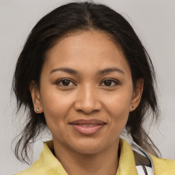 Joyful white adult female with medium  brown hair and brown eyes