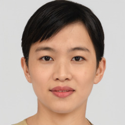 Joyful asian young-adult female with short  black hair and brown eyes