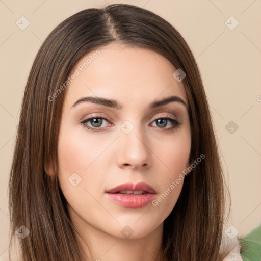 Neutral white young-adult female with long  brown hair and brown eyes