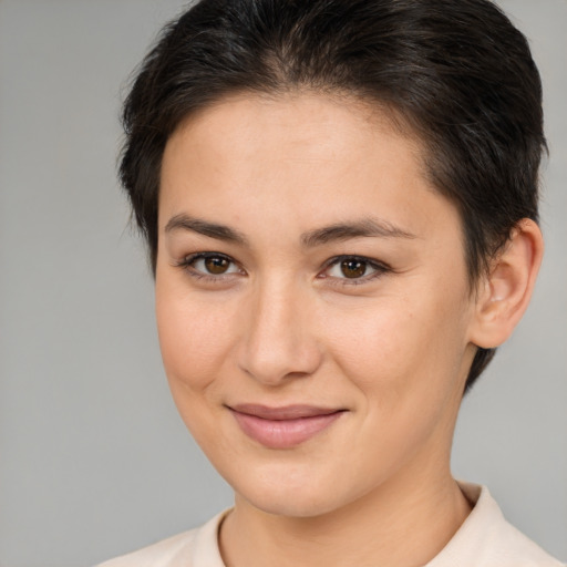 Joyful white young-adult female with medium  brown hair and brown eyes