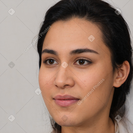 Joyful latino young-adult female with medium  brown hair and brown eyes