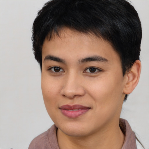 Joyful asian young-adult male with short  brown hair and brown eyes