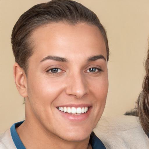 Joyful white young-adult female with short  brown hair and brown eyes