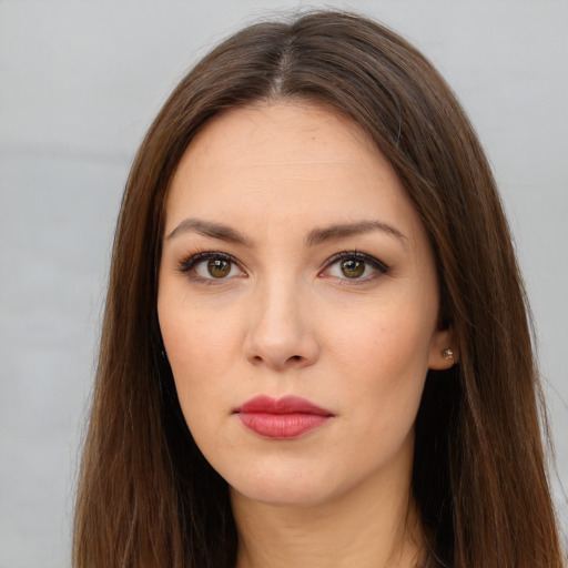 Neutral white young-adult female with long  brown hair and brown eyes