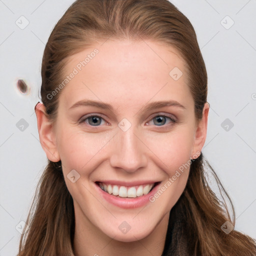 Joyful white young-adult female with long  brown hair and blue eyes