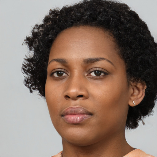 Neutral black young-adult female with medium  black hair and brown eyes