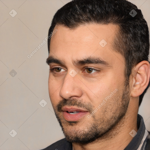 Joyful white young-adult male with short  black hair and brown eyes