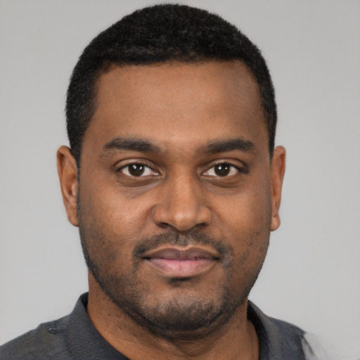 Neutral black young-adult male with short  black hair and brown eyes