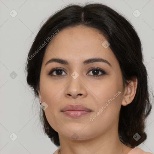 Joyful latino young-adult female with medium  brown hair and brown eyes