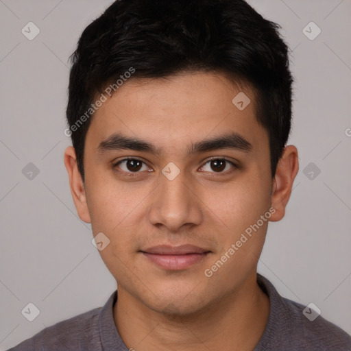 Joyful white young-adult male with short  black hair and brown eyes