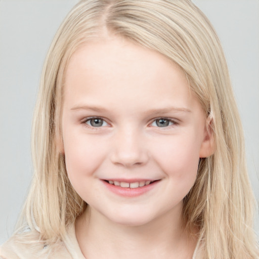 Joyful white child female with long  brown hair and blue eyes