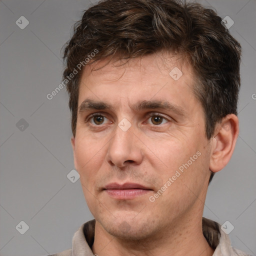 Joyful white adult male with short  brown hair and brown eyes