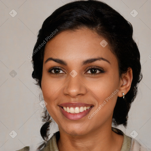 Joyful latino young-adult female with medium  brown hair and brown eyes