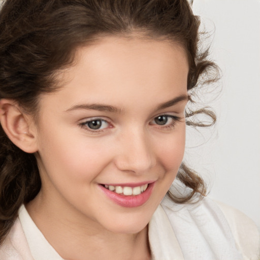 Joyful white child female with medium  brown hair and brown eyes