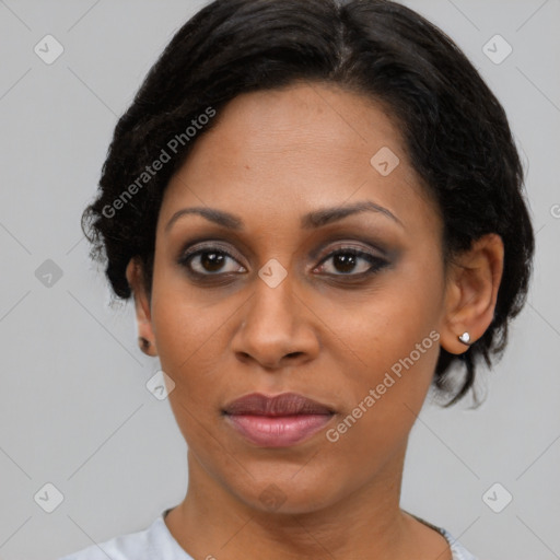 Joyful black young-adult female with short  brown hair and brown eyes