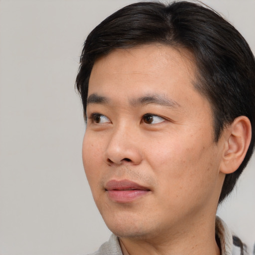 Neutral asian young-adult male with short  black hair and brown eyes