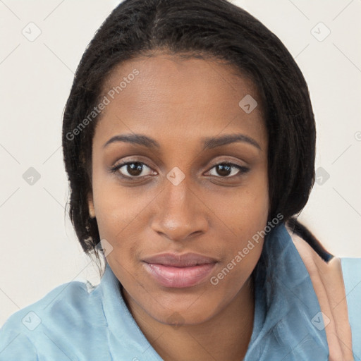 Joyful black young-adult female with long  brown hair and brown eyes